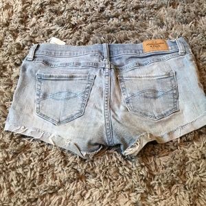 Light wash jean shorts.